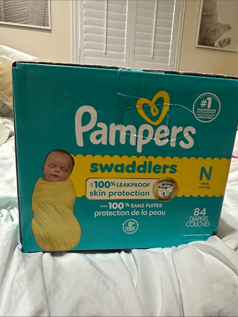 Swaddlers Newborn Diapers - Teal/Yellow 42 out of 84 left. Half package unopened